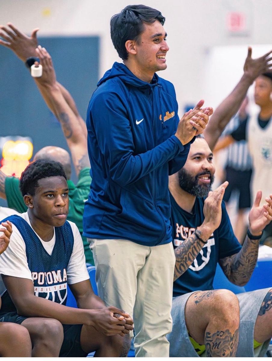 Coach Kyle cheering on players